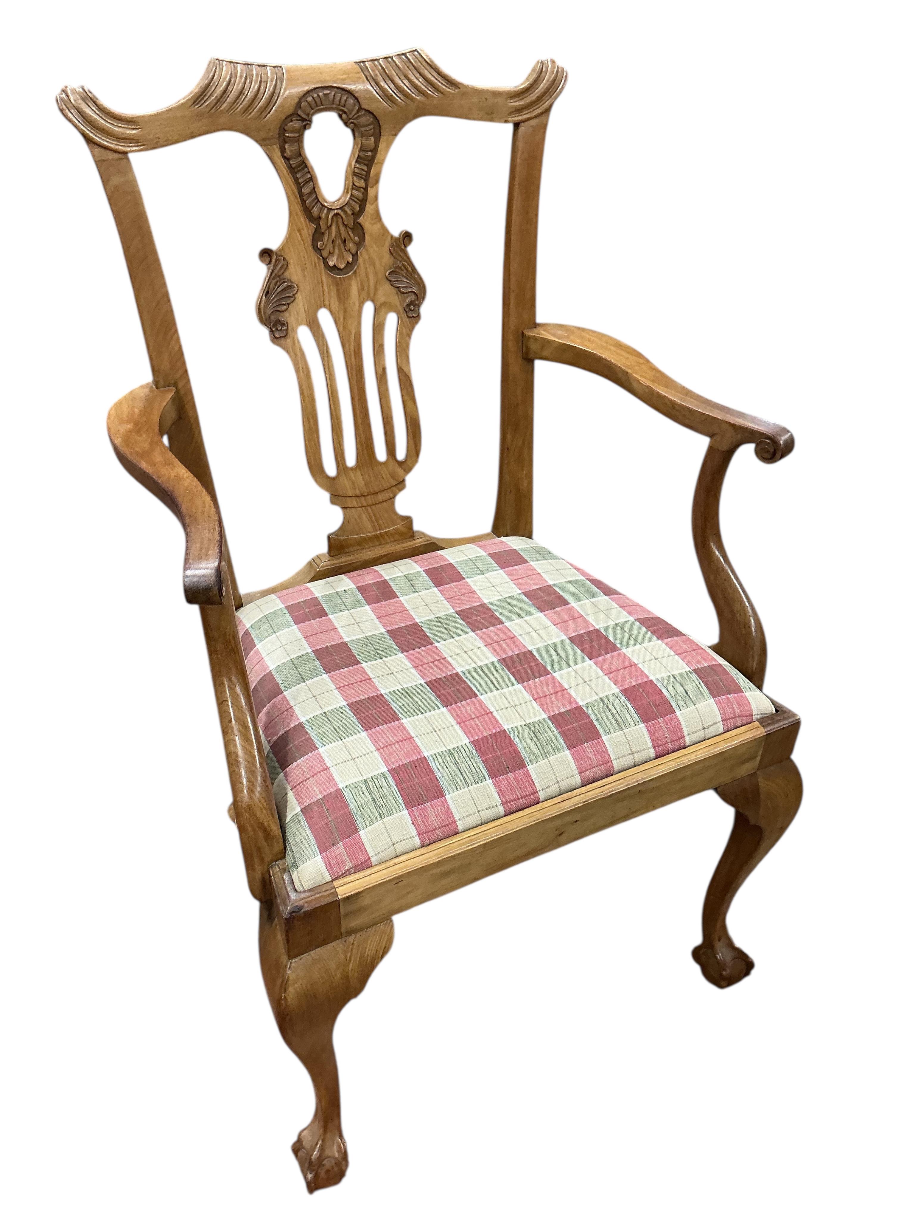 A George III style walnut extending dining table, (no leaves), 124cm, depth 104cm, height 74cm and six dining chairs, two with arms